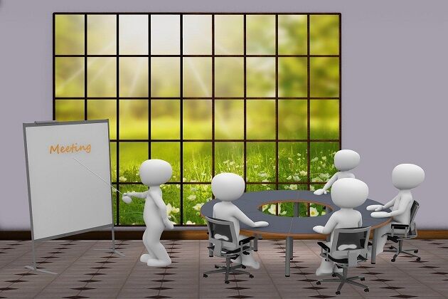 Grafika przedstawia postacie siedzące i rozmawiające na spotkaniu