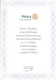 Dokument potwierdzający darowiznę Rotary Club Kraków dla Domu Pomocy Społecznej.