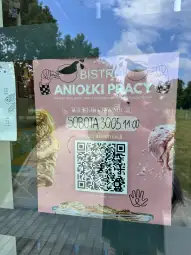 Plakat zapraszający na otwarcie bistro Aniołki Pracy, z datą i kodem QR.
