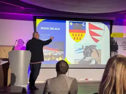 Prezentacja dotycząca Mihai Belali z herbami i historycznymi ilustracjami.