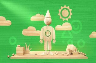 Grafika przedstawia drewnianego pajacyka, na zielonym tle.