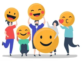 Grupa ludzi trzymająca duże emotikony z uśmiechami.
