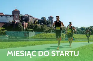 Biegaczy na trasie, z widokiem na zamek w Krakowie. Miesiąc do startu biegu.