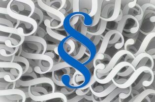 Grafika przedstawia symbol paragrafu w kolorze niebieskim, a w tle widoczne są te symbole w kolorze białym.
