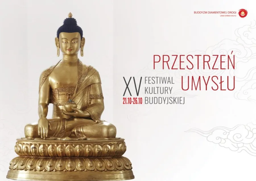 Złota figura Buddy z napisem o festiwalu kultury buddyjskiej.