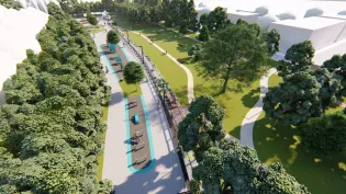 Zielony park z alejkami, drzewami i strefą do ćwiczeń na świeżym powietrzu.