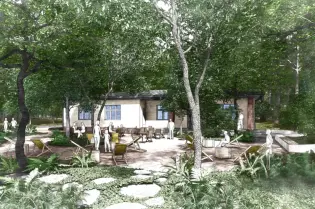 Nowoczesny dom w otoczeniu drzew i zieleni, z miejscem do wypoczynku na świeżym powietrzu.